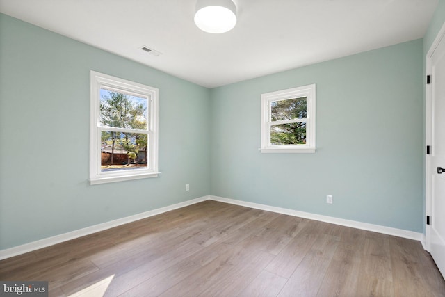 spare room with light hardwood / wood-style floors