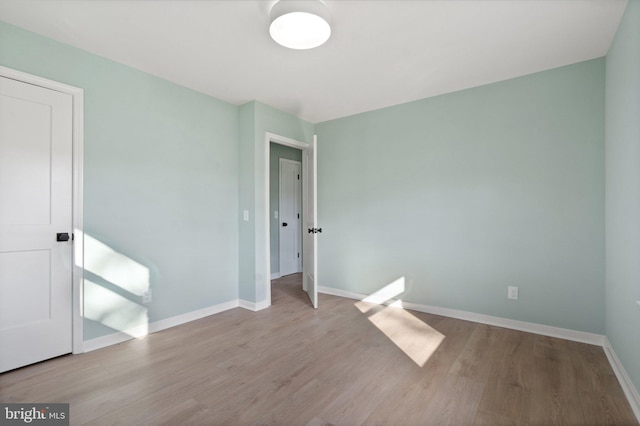 unfurnished bedroom featuring light wood-type flooring