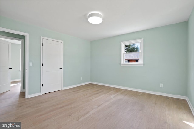 unfurnished room featuring light hardwood / wood-style flooring