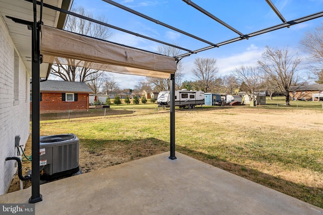 view of yard featuring central AC unit and a patio