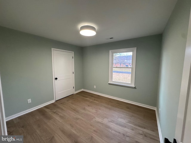 spare room featuring light wood-type flooring