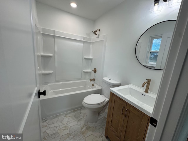 full bathroom featuring toilet, vanity, and tub / shower combination