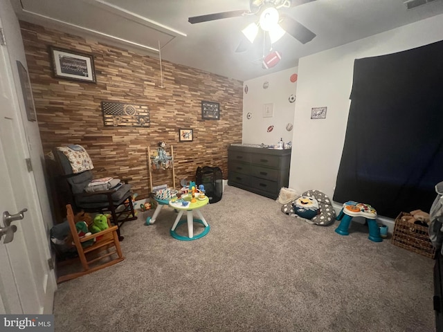 rec room with carpet flooring and ceiling fan