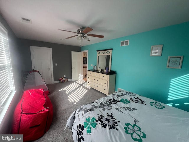 bedroom with ceiling fan and carpet floors