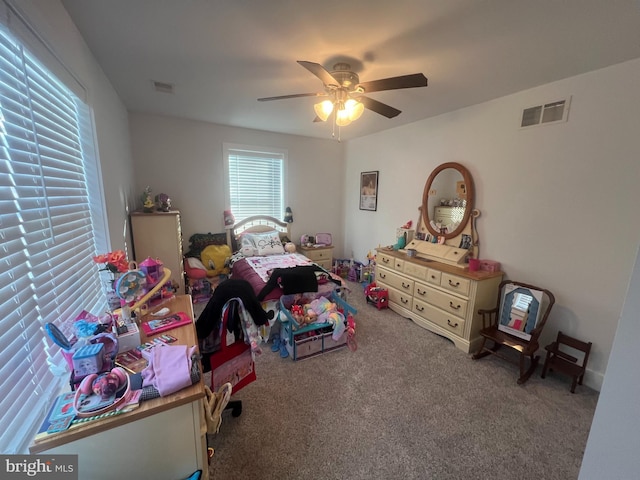 carpeted bedroom with ceiling fan