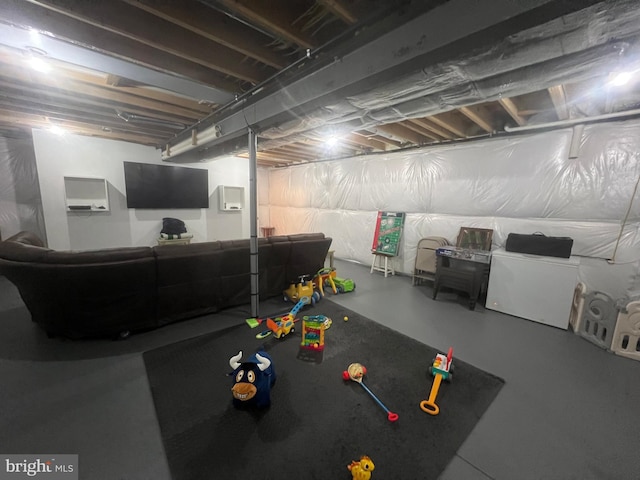 rec room featuring concrete floors