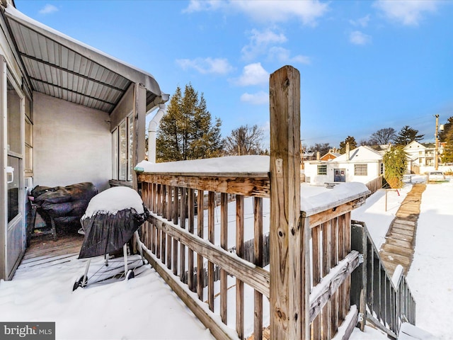 view of snow covered deck