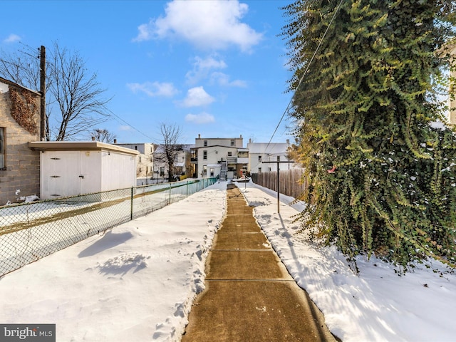 view of yard layered in snow