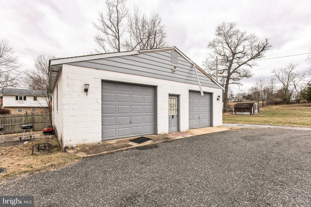 detached garage with fence