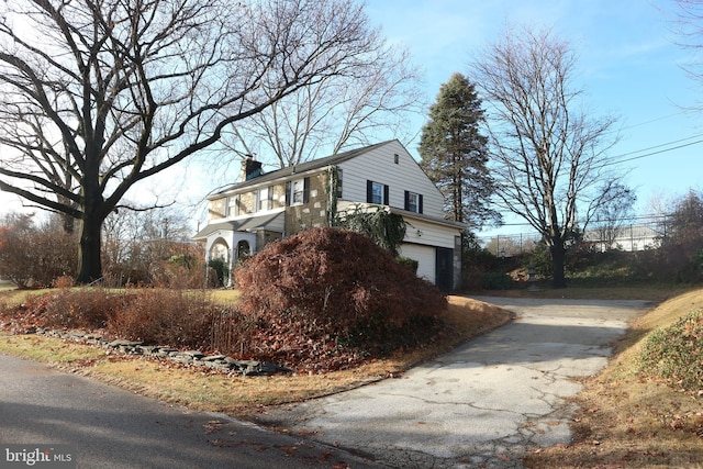 view of side of property featuring a garage