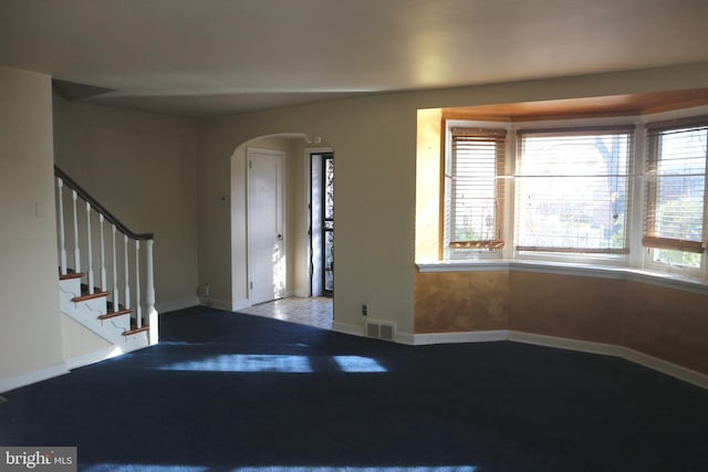 view of carpeted entrance foyer