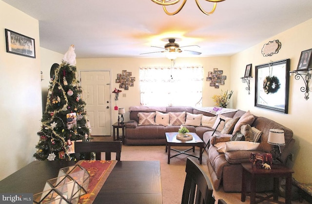 living room with plenty of natural light, ceiling fan, and light carpet