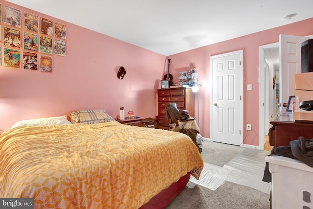 carpeted bedroom featuring white refrigerator