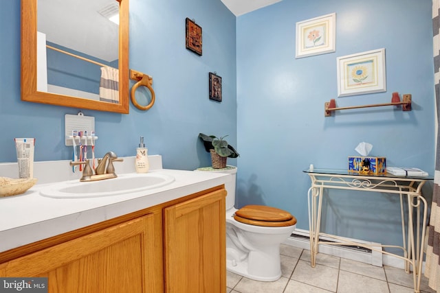 bathroom featuring tile patterned floors, vanity, and toilet