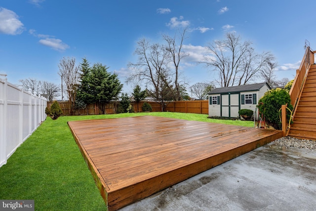 deck featuring a lawn and an outbuilding