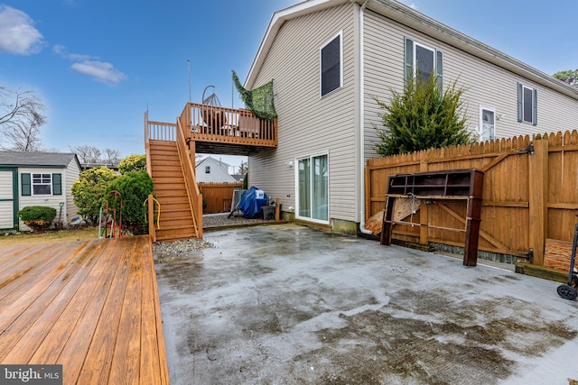 rear view of house featuring a deck and a patio