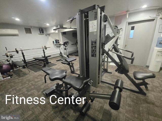 gym with carpet floors and a wall mounted air conditioner