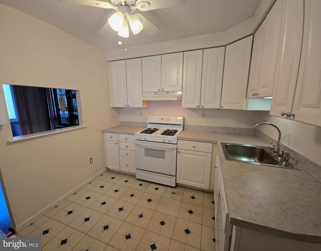 kitchen featuring white cabinetry, sink, ceiling fan, and white gas range oven