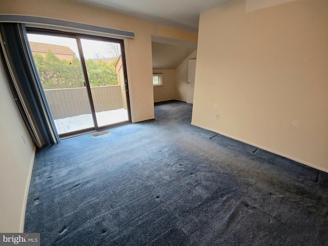 interior space with dark colored carpet