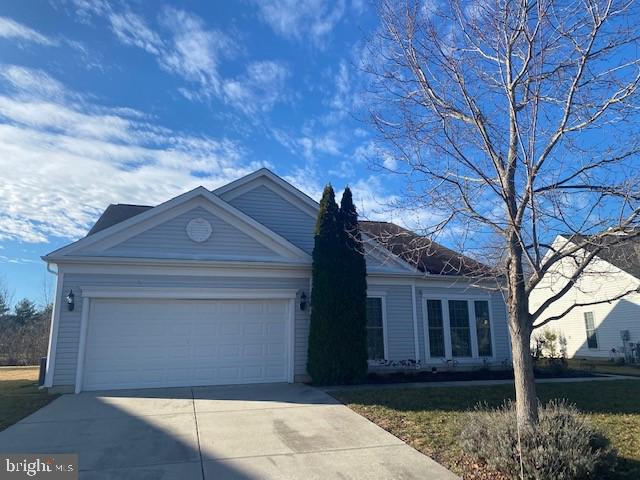 single story home with a garage