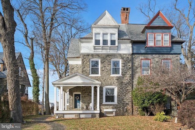 victorian-style house featuring covered porch