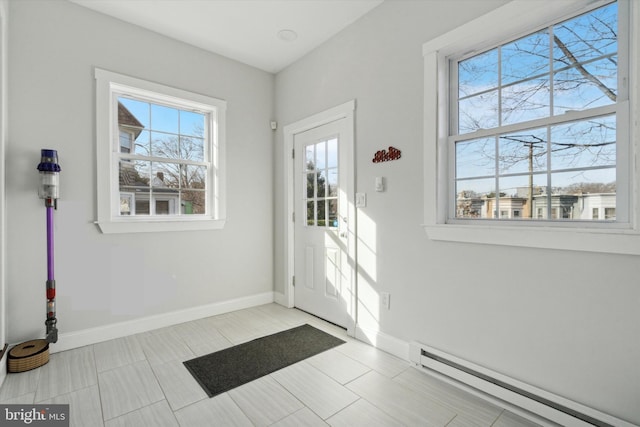 entryway with plenty of natural light and a baseboard radiator