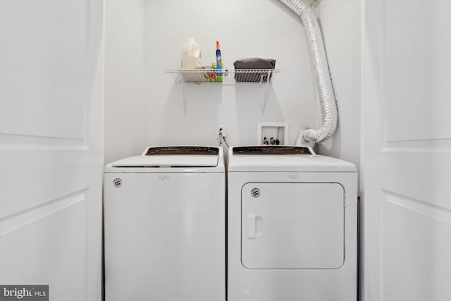 laundry area with washing machine and dryer