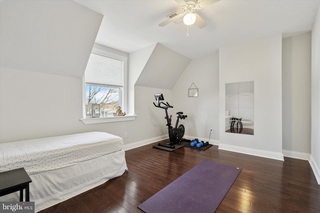 bedroom featuring ceiling fan, dark hardwood / wood-style flooring, and vaulted ceiling