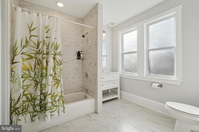 bathroom with shower / bath combo and toilet