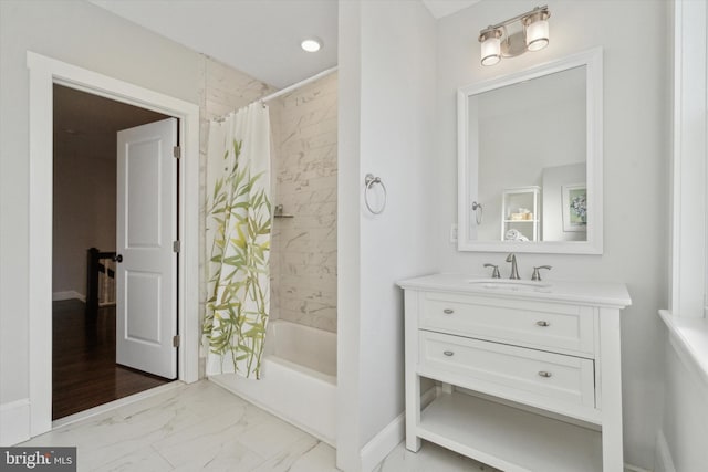 bathroom featuring vanity and shower / bathtub combination with curtain