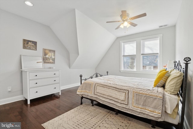 bedroom featuring ceiling fan, dark hardwood / wood-style floors, and lofted ceiling