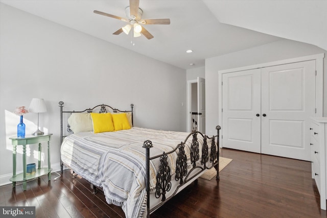 bedroom with ceiling fan, a closet, and dark wood-type flooring