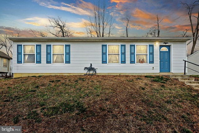 view of front of house with a lawn