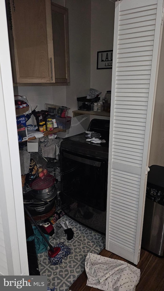 kitchen with dark hardwood / wood-style floors and black electric range oven