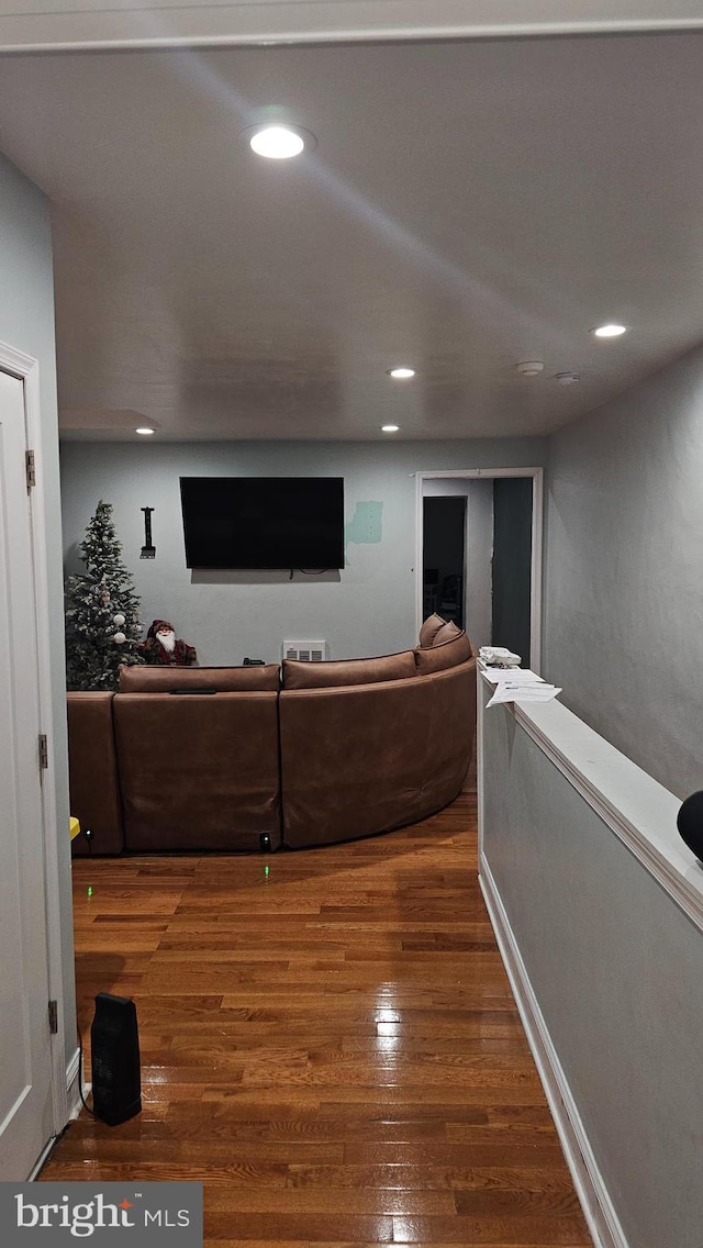 living room with dark hardwood / wood-style flooring