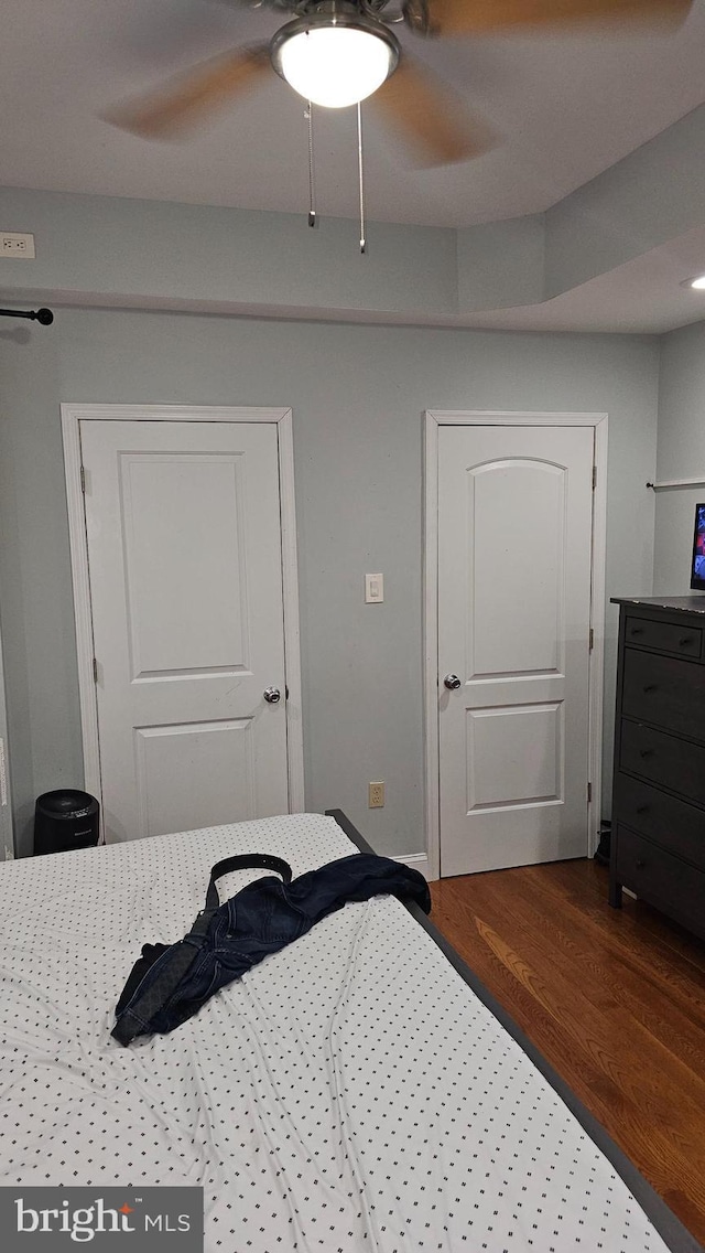 bedroom with hardwood / wood-style floors and ceiling fan