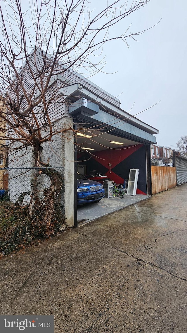 view of parking / parking lot featuring a carport