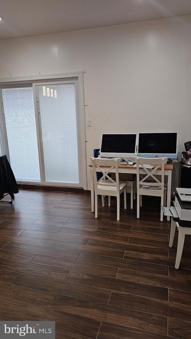 dining room with dark hardwood / wood-style floors