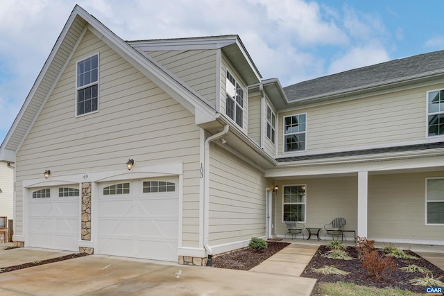 view of front of house featuring covered porch and a garage