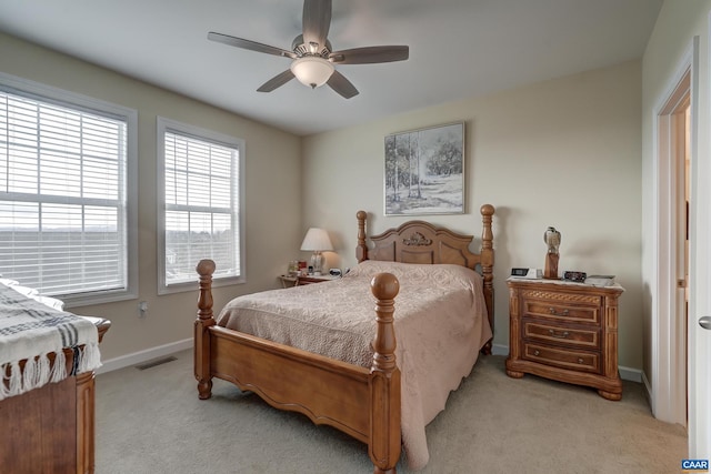 bedroom with light carpet and ceiling fan