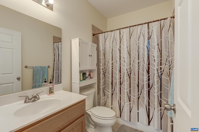 full bathroom featuring shower / bath combo, toilet, and vanity