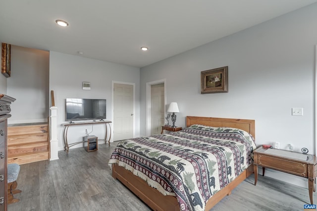 bedroom with hardwood / wood-style floors