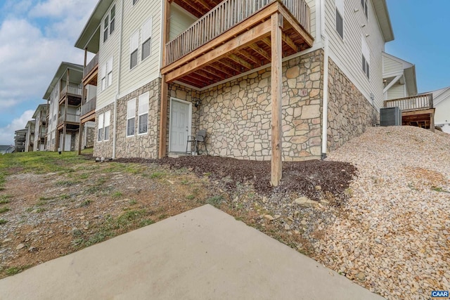 view of home's exterior with central AC