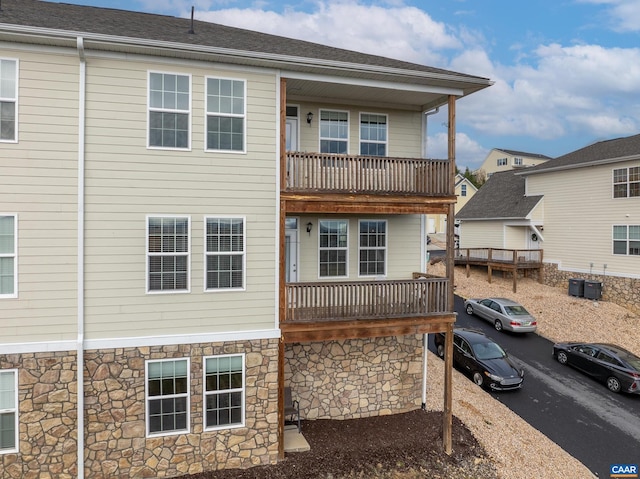 back of property with a balcony