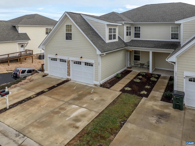 front facade with covered porch and a garage