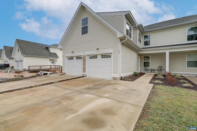 view of front of home with a porch and a garage