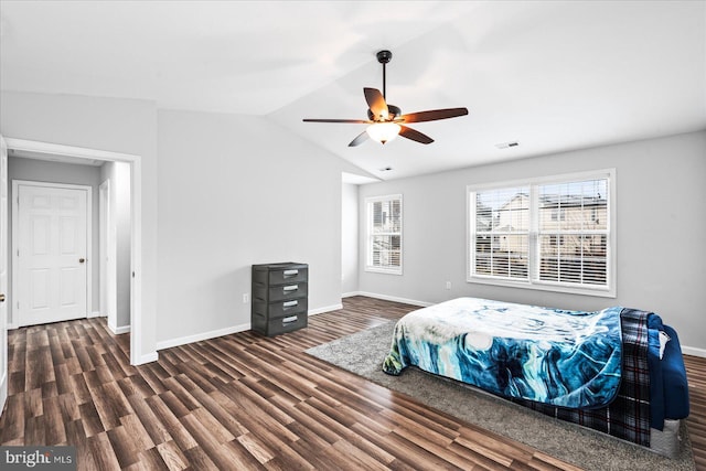 bedroom featuring ceiling fan, lofted ceiling, and dark wood-type flooring