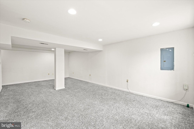 basement with carpet floors and electric panel