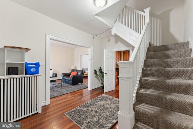 stairs with wood-type flooring