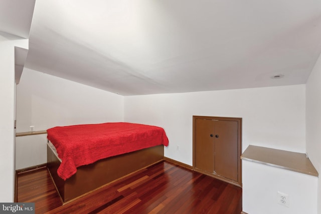 bedroom featuring dark wood-type flooring